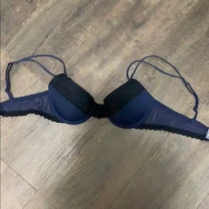 A blue bra with black lace